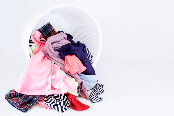istock a pile of colorful clothes on white background 1203247238
