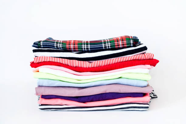 istock a pile of colorful clothes on white background 1203247373