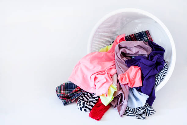 istock a pile of colorful clothes on white background 1203247470