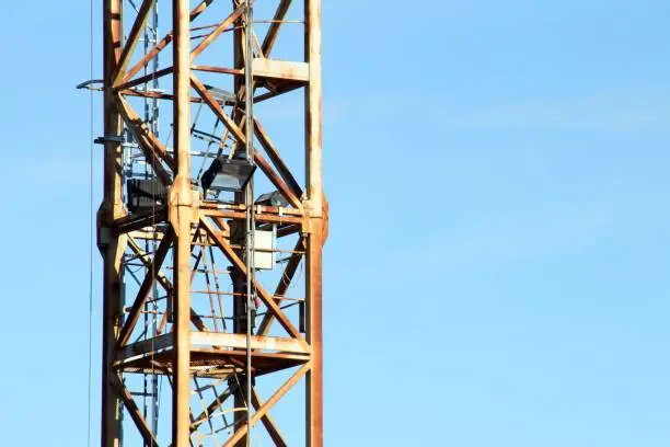 Detail of the crane, of the construction site, in rusty iron.