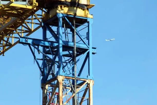 Detail of the crane, of the construction site, in rusty iron.