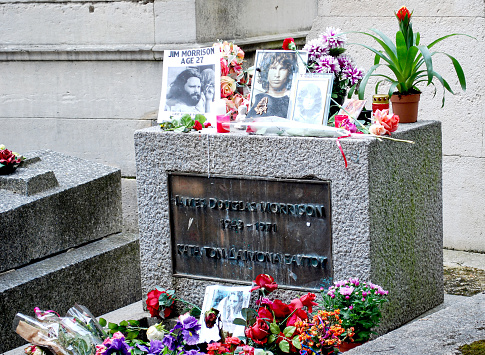 Paris, France; 07/12/2014: Detail of the tomb of the famous singer of the band The Doors, Jim Morrison in the Père Lachaise cemetery in Paris, France