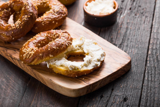 istock Bagels sandwich with cream cheese on wooden table 1203255654