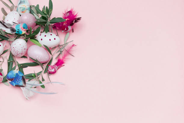 Flat Lay of Olive Branch and Easter Decoration on Pink Background