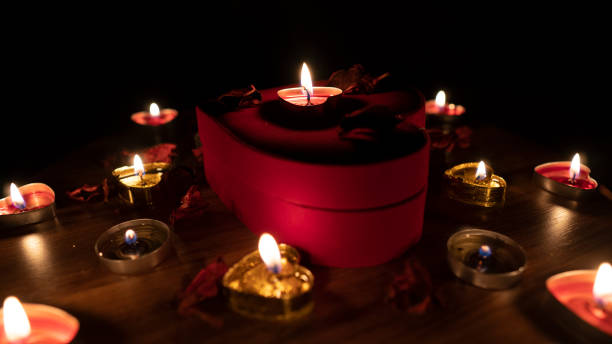 istock Romantic table valentine day with red hearts and candle 1203257348