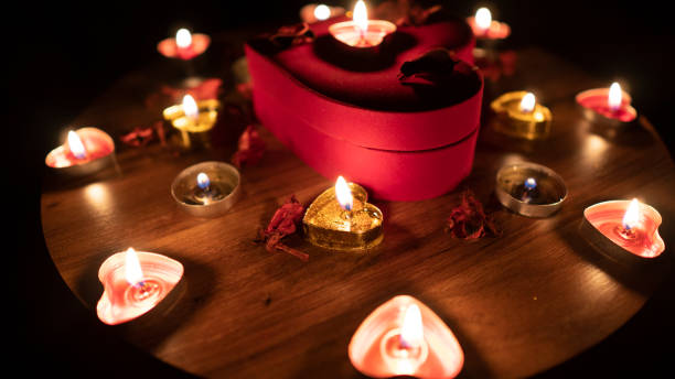 istock Romantic table valentine day with red hearts and candle 1203257426