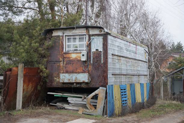 istock one old rusty metal trailer with a window on the street 1203260562
