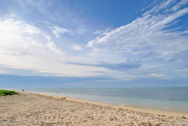 istock Tropical beach with fine white sand and gorgeous clouds 1203262221