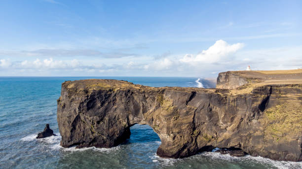 istock Natural stone bridge over the ocean 1203265403