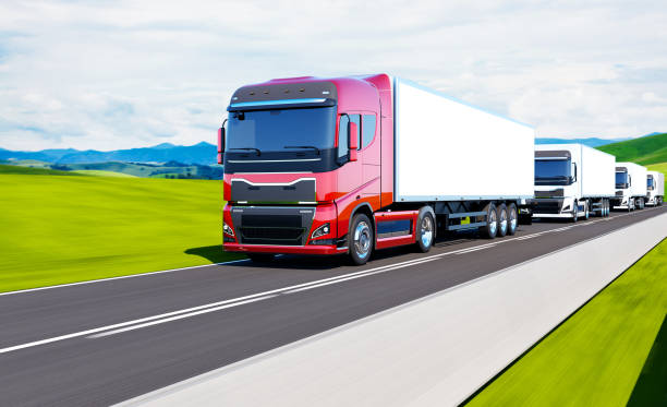 istock semi-truck with trailer driving on road 1203267474