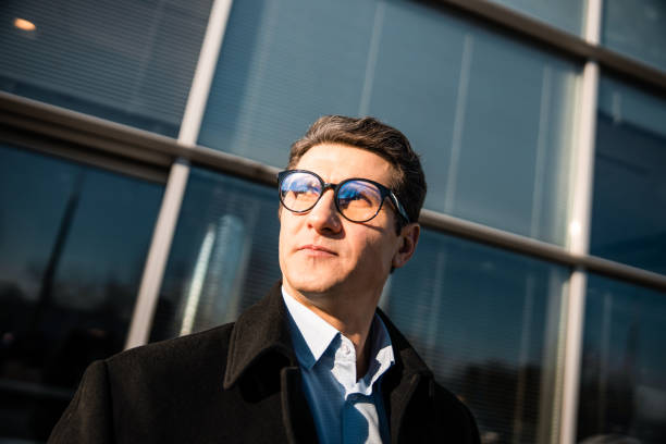 istock Man in eyeglasses staring into the distance 1203273763