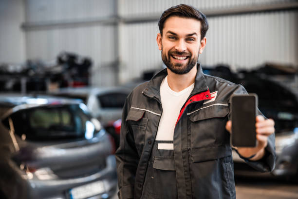 istock Man in overalls looking in front of him 1203273797