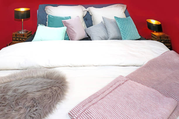 istock Made up bed in modern bedroom 1203275618