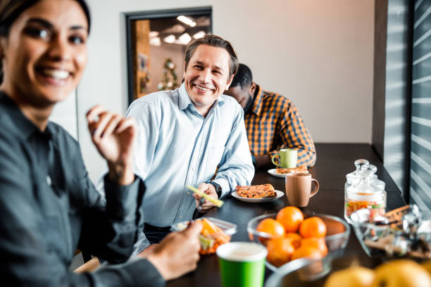 istock Positive delighted young people having time for dinner 1203282704