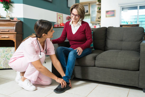 istock Caregiver Helping Senior Patient In Routine Work 1203284523