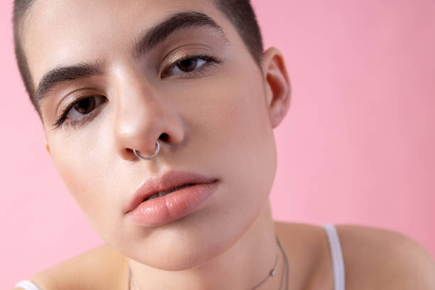 istock Attractive lady with small nose piercing stock photo 1203287332