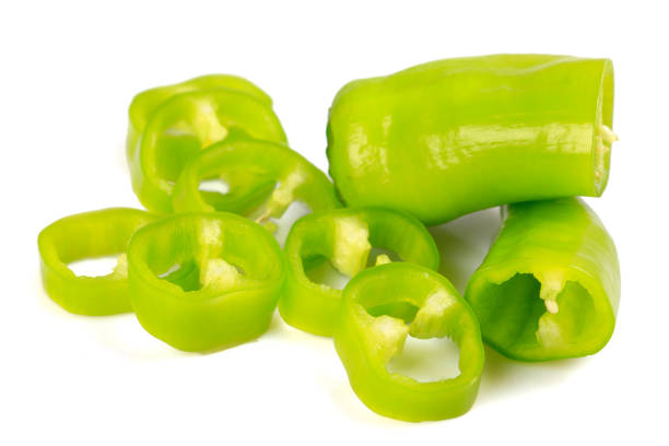 istock Raw Green Organic Shishito Peppers  isolated on white background 1203290314