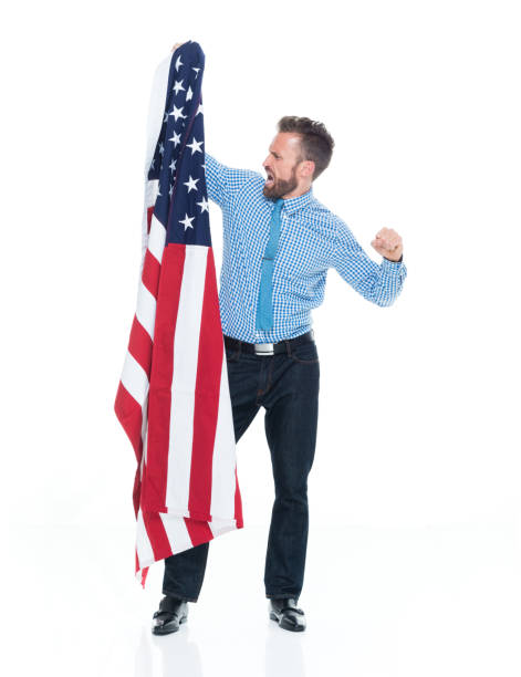 istock Caucasian male standing wearing button down shirt and holding flag 1203292462