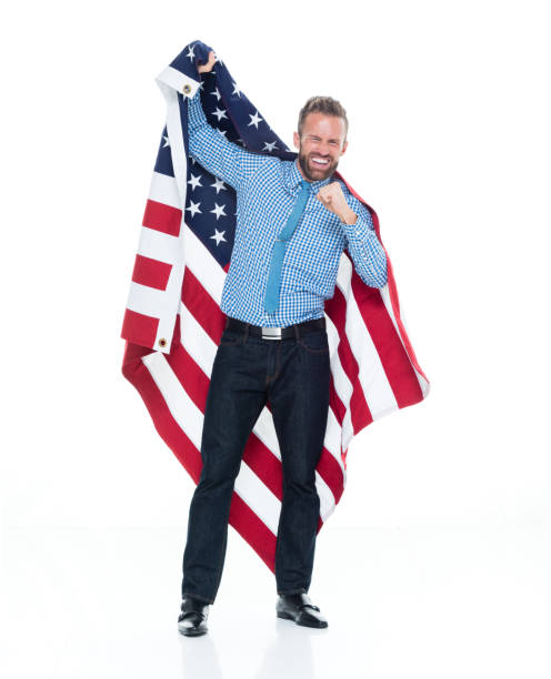 istock Caucasian male standing wearing button down shirt and holding flag 1203292467