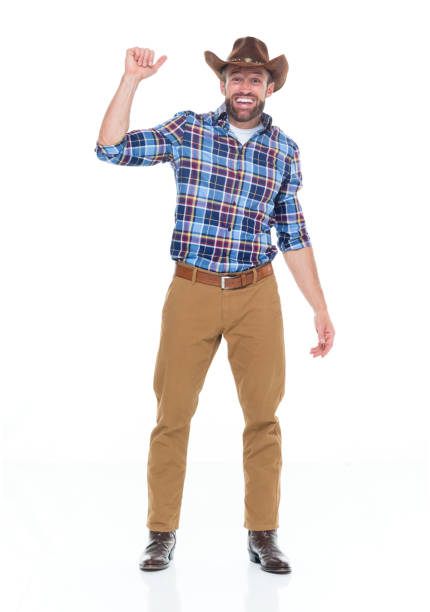 istock Caucasian male cowboy standing wearing hat 1203292532