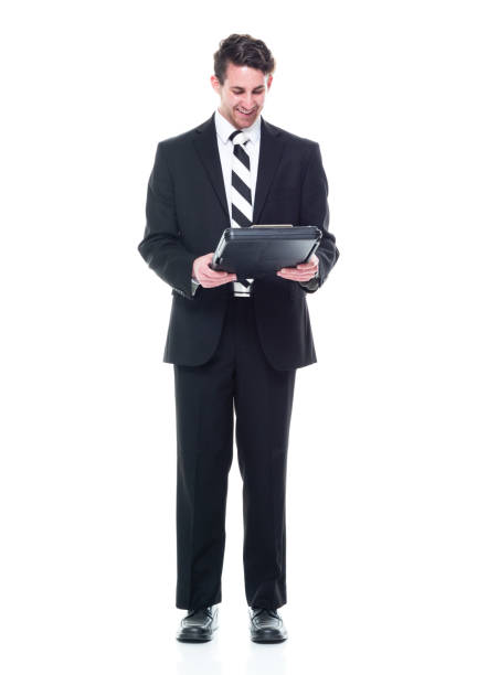 istock Caucasian young male manager crouching and holding document 1203294966