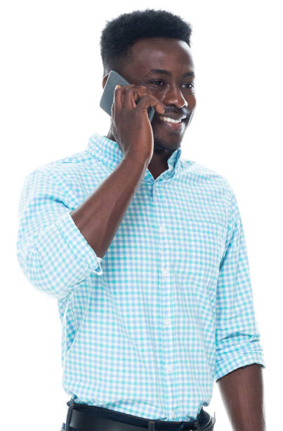 istock Generation z male standing wearing button down shirt and using mobile phone 1203296412