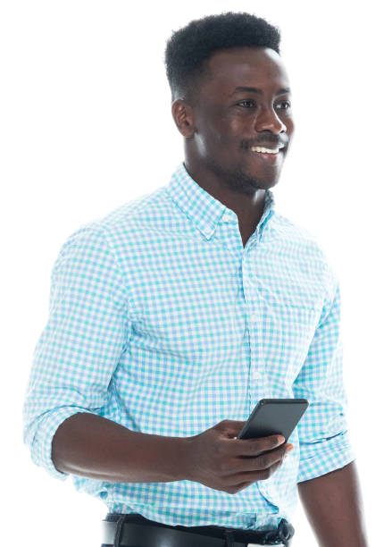 istock African-american ethnicity male wearing button down shirt and holding bag and using smart phone 1203296436