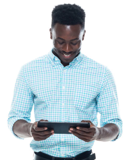 istock African-american ethnicity male standing wearing button down shirt and using digital tablet 1203296442