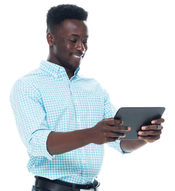 istock African ethnicity male standing wearing shirt and using digital tablet 1203296998