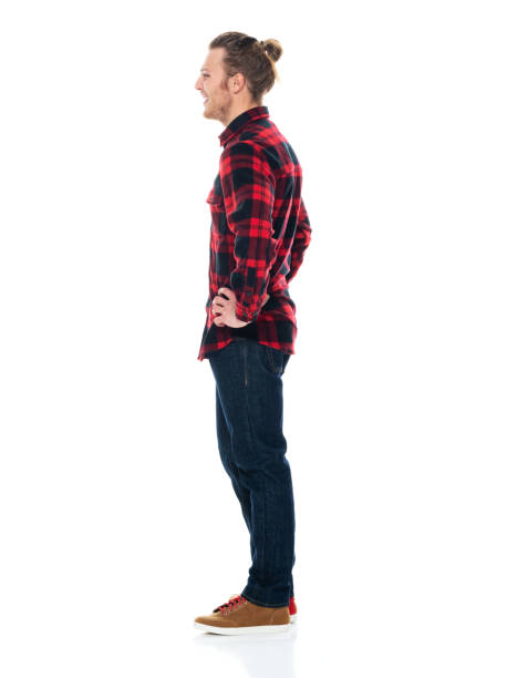 istock Caucasian young male standing wearing jeans 1203298732