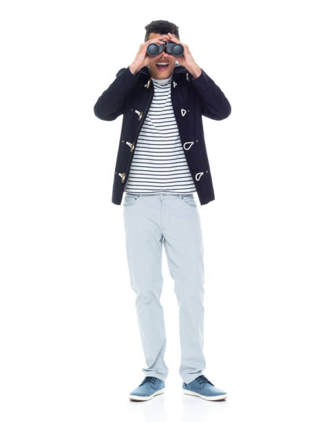 istock African ethnicity male wearing jacket and holding binoculars 1203299617