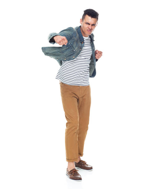 istock African ethnicity male standing wearing denim jacket 1203299910