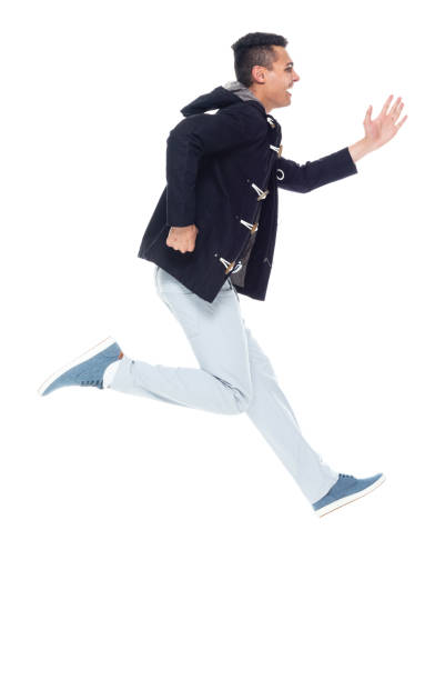 istock African ethnicity male jumping wearing jacket 1203299954