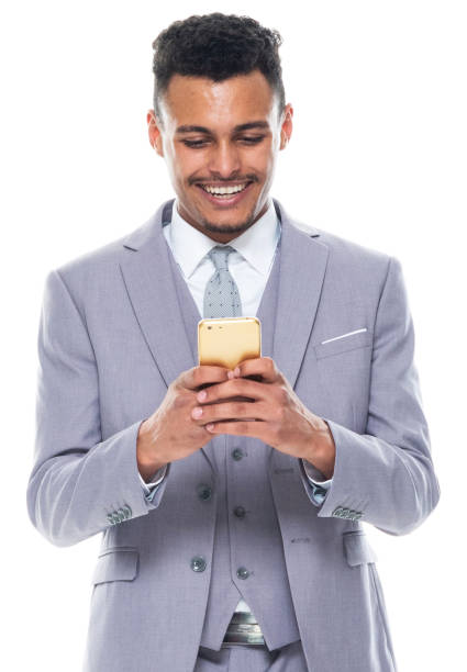 istock African-american ethnicity young male standing and using mobile phone 1203301293