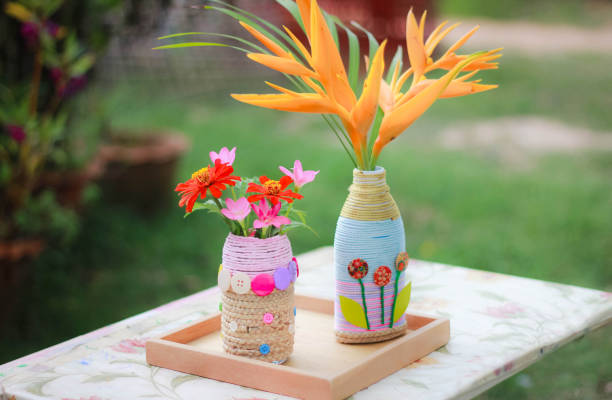 A 6-year-old Asian child doing crafts D.I.Y. Flower Vases from Waste Materials ,