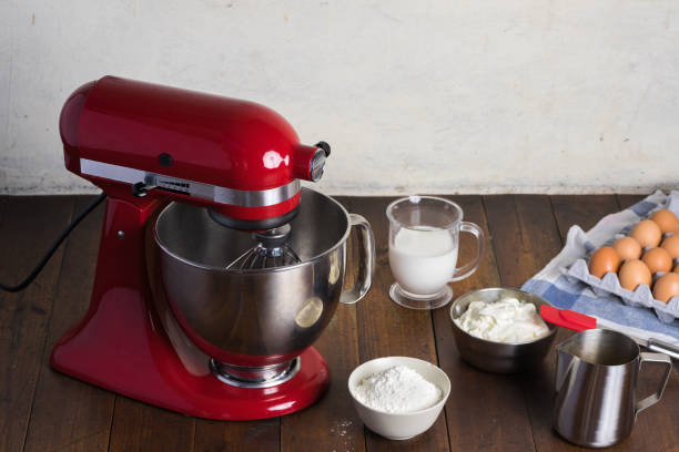 istock Red standing mixer on wooden table 1203304576