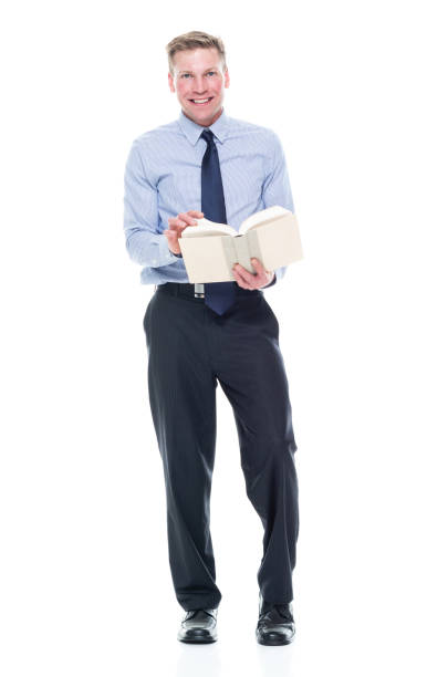 istock Caucasian male university student standing and holding textbook 1203305137