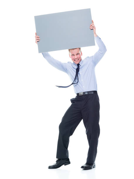 istock Caucasian male manager standing and holding placard 1203305157