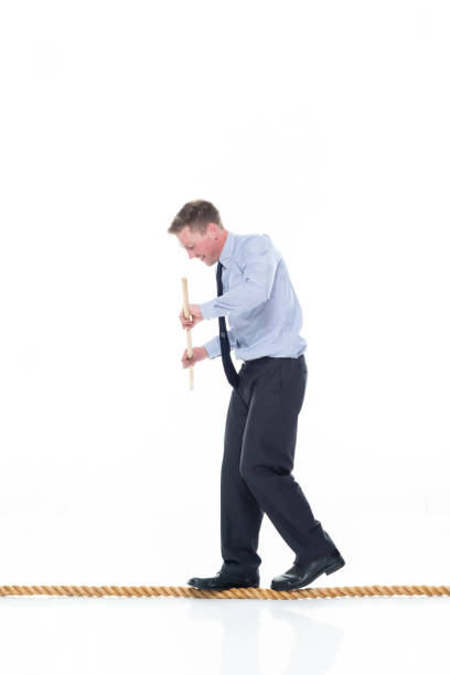 istock Caucasian male manager agility wearing necktie and using rope 1203305201