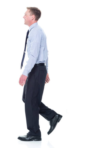 istock Caucasian male businessman walking 1203305204