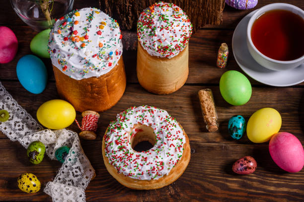 istock Easter cake and colorful eggs on a dark background 1203305378