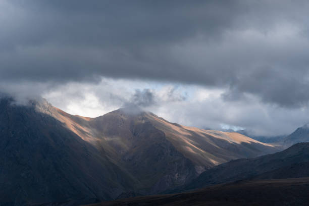 istock beautiful landscape in the highlands, textural hills with incident light. 1203308041