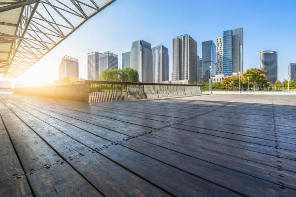 istock Empty wooden floor with modern buildings background 1203313346