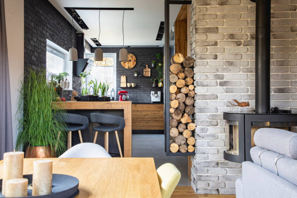 istock Stylish and trendy kitchen with black brick wall in modern home 1203314263