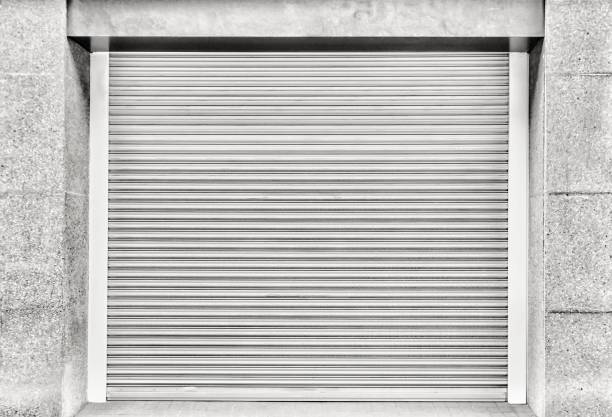 istock Steel shutter door of warehouse, storage or storefront for background and textured. 1203314986
