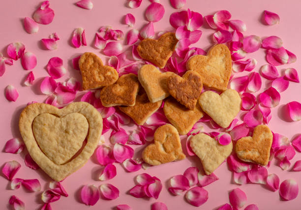 istock Cookies valentines are on rose petals 1203317693