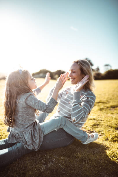 istock mother and daughter playing together 1203319427