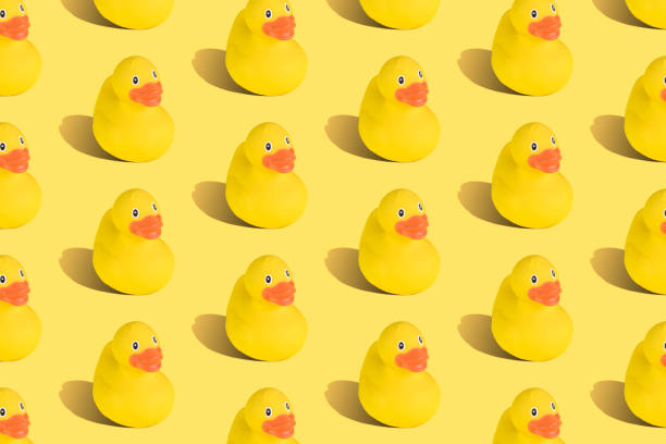 istock Collection of yellow rubber ducks texture abstract. 1203321157
