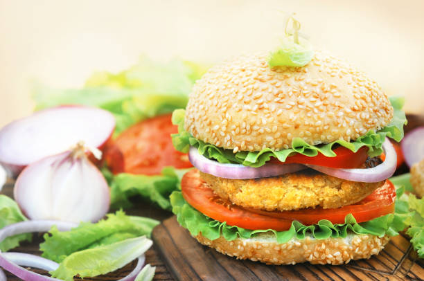 istock Veggie burger with chickpeas patty, vegan fast food 1203321637
