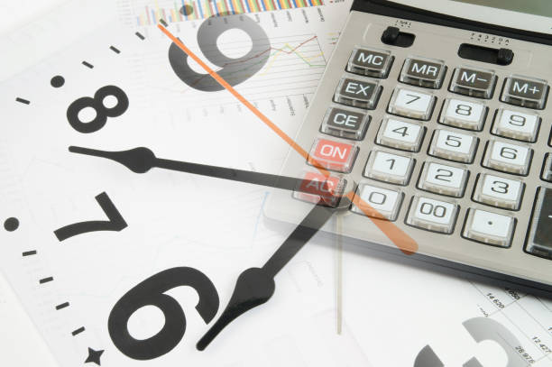 grafici finanziari con orologio e calcolatrice - finance stock market data diagram calculator foto e immagini stock